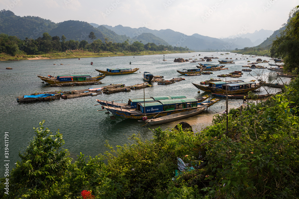 Boats on the river with mountains