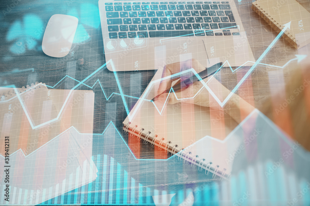 Financial graph displayed on woman's hand taking notes background. Concept of research. Multi exposure