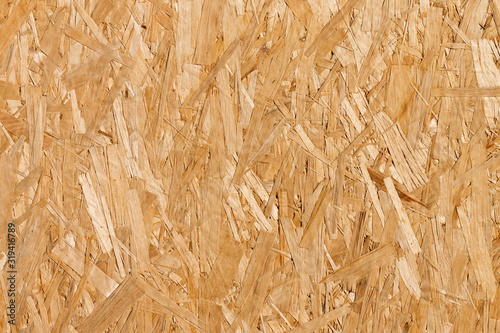 Fototapeta Naklejka Na Ścianę i Meble -  Flat lay wood chipboard. Horizontal wood texture. OSB - oriented strand board. Abstract seamless wooden background.