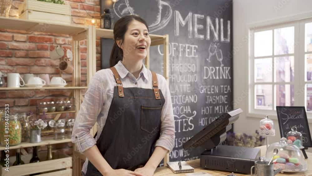 small business people takeaway and service concept. happy female waitress giving bag and paper cup with hot drink to customer at coffee shop. young smiling girl barista serving client and wave hands.
