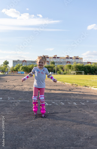 Child learns to roller skate. Roller skating