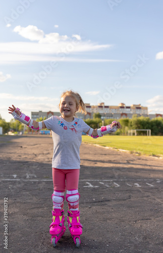 Child learns to roller skate. Roller skating