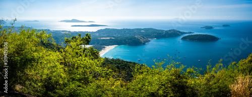 Panorama of the south of the Phuket island with Nai Harn beach and tropical islands, Thailand