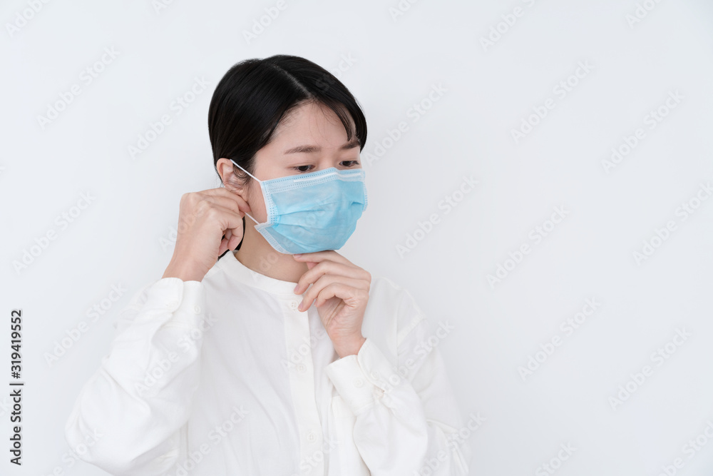 Asian woman wearing a mouth protection to prevent getting sick