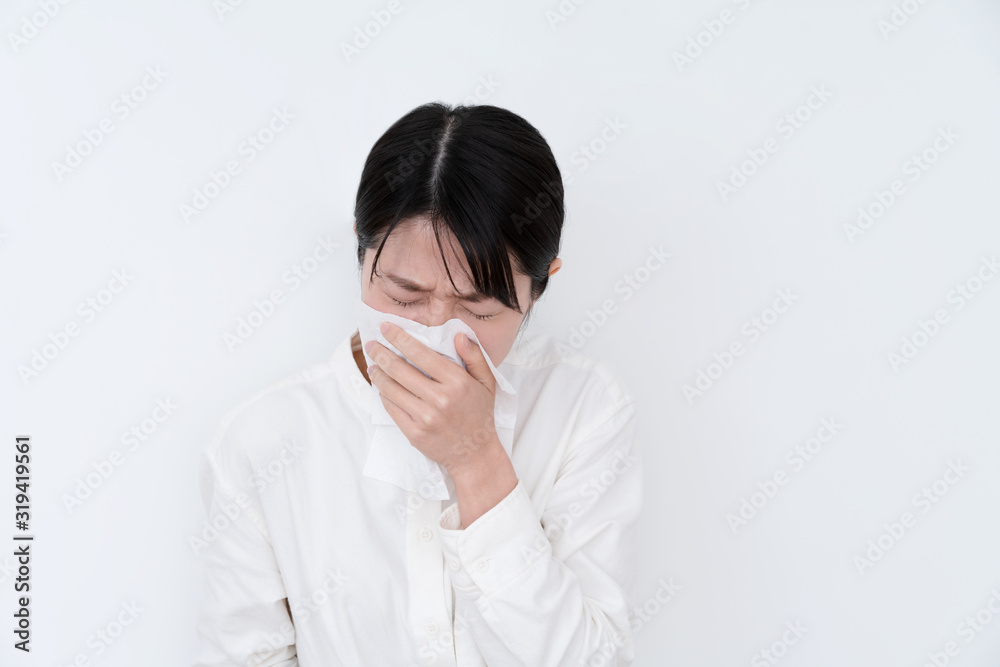 Young ill woman coughing on white background Young ill woman coughing on white background