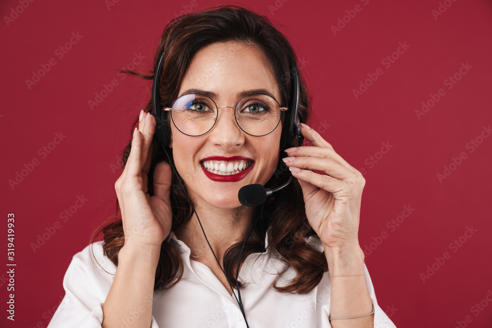 Woman work in callcenter talking by cellphone. Woman work in callcenter talking by cellphone.