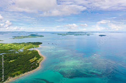 Seascape with islands in the early morning, view from above. Caramoan Islands, Philippines. Malay archipelago with reefs and islands. © Tatiana Nurieva