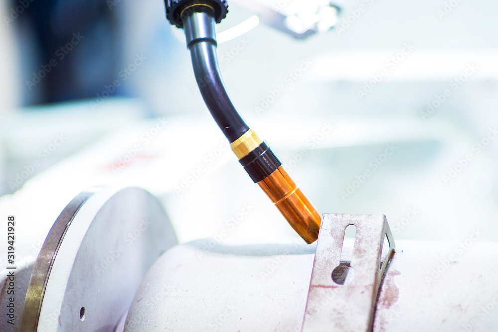 Фотография Automatic robotic arm for metal welding operations