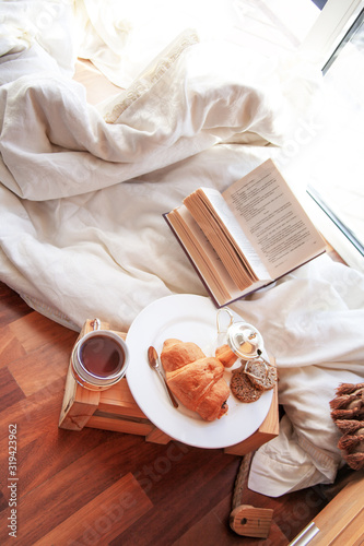 close-up of french breakfast with croissant bunbook and linels