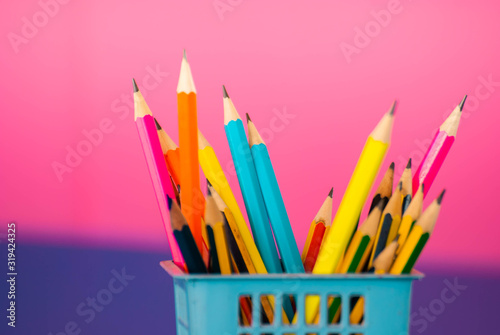 Colored pencils in a pink box