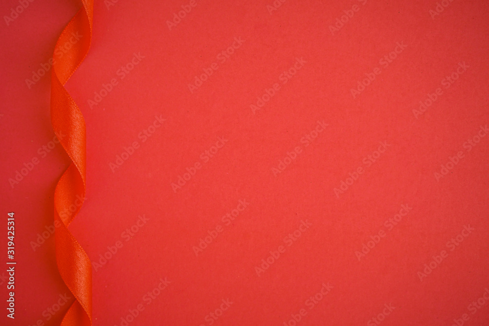 red abstract background and satin ribbon with copy space for text red abstract background and satin ribbon with copy space for text