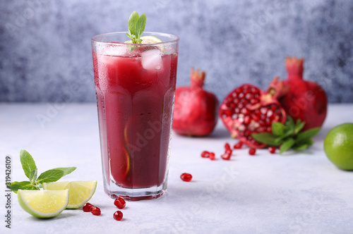 A cold, refreshing, delicious cocktail made from natural pomegranate juice, lime, mint and ice cubes, a healthy and vitamin-rich drink to quench your thirst in summer.