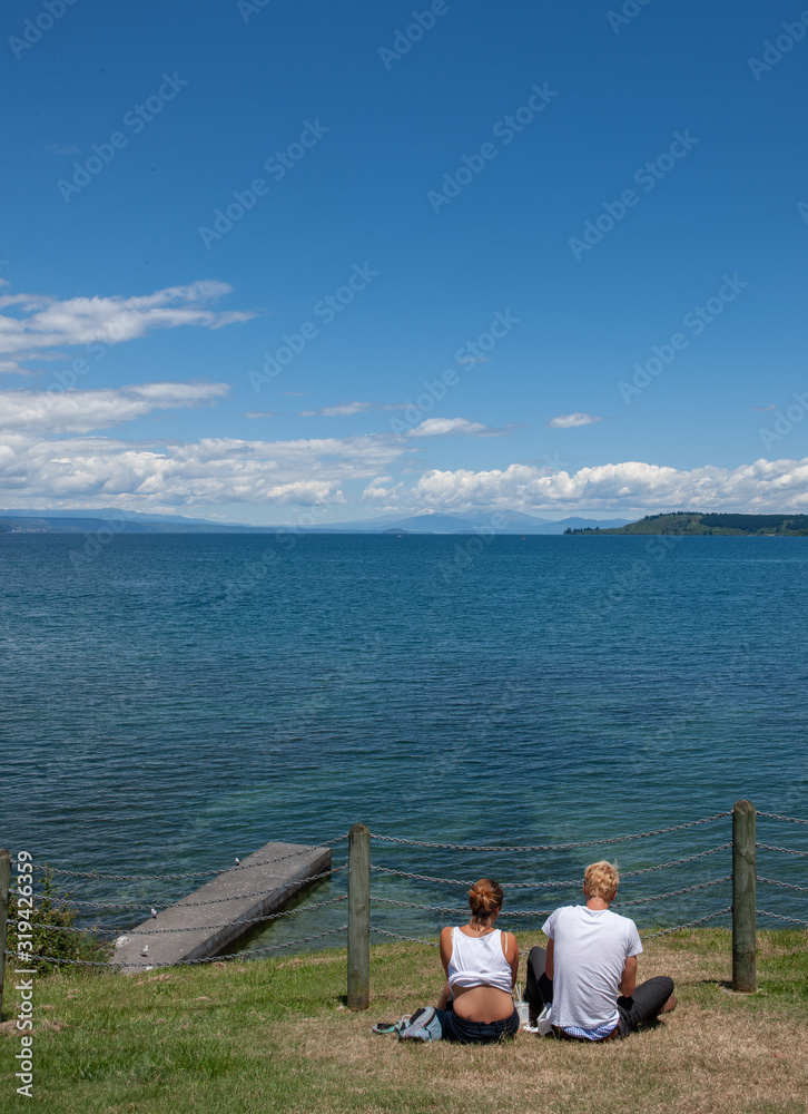 Couple overlooking Lake Taupo New Zealand. Great view together at lake Taupo.