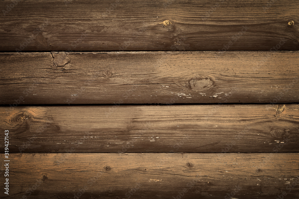 Fototapeta premium Wall of horizontal old rustic brown boards with peeling paint. Abstract modern trendy wood texture background