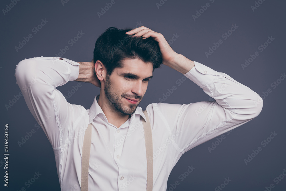Closeup photo of attractive business man macho touch hairstyle charming smiling looking empty space dressed formalwear white shirt beige suspenders isolated grey color background Closeup photo of attractive business man macho touch hairstyle charming smiling looking empty space dressed formalwear white shirt beige suspenders isolated grey color background