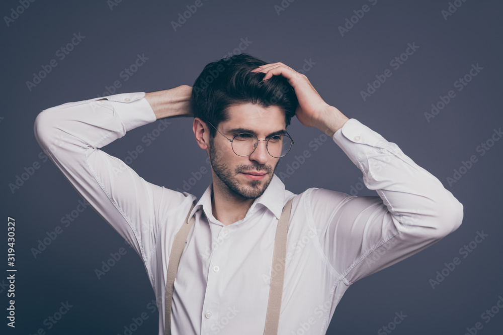 Closeup photo of handsome business man macho responsible chief touch perfect hairstyle dressed formalwear white shirt beige suspenders specs isolated grey color background Closeup photo of handsome business man macho responsible chief touch perfect hairstyle dressed formalwear white shirt beige suspenders specs isolated grey color background