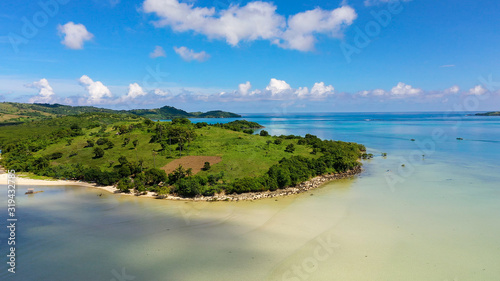 Tropical island with a white beach. Caramoan Islands  Philippines. Beautiful islands  view from above. Summer and travel vacation concept.