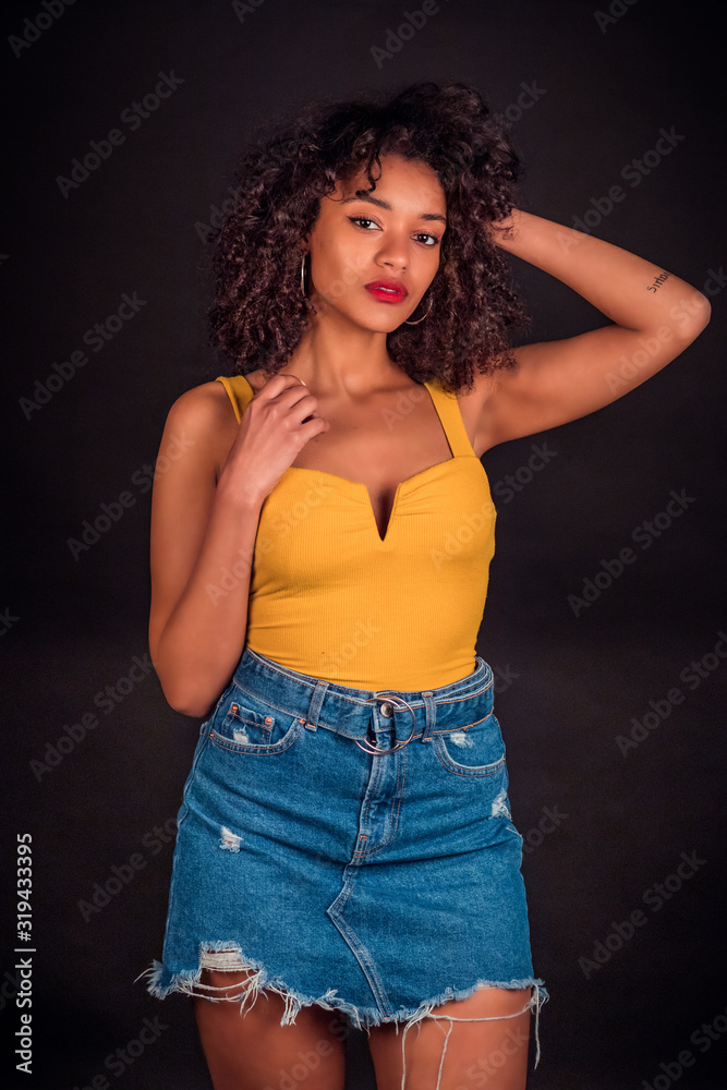 African Girl in yellow and jeans African Girl in yellow and jeans