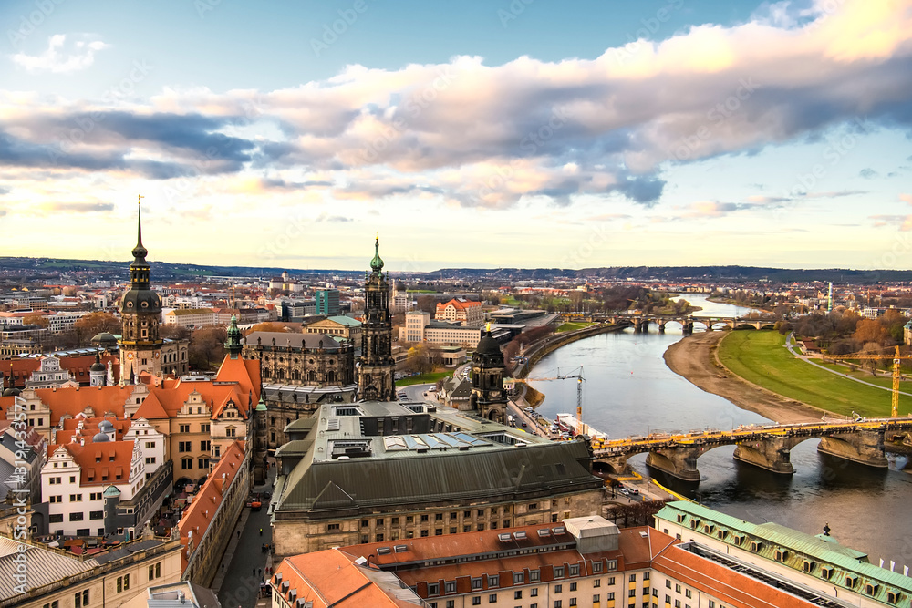 Panorama of Dresden city with bridges over Elbe river at sunset from lutheran church of Our Lady Frauenkirche, Germany.