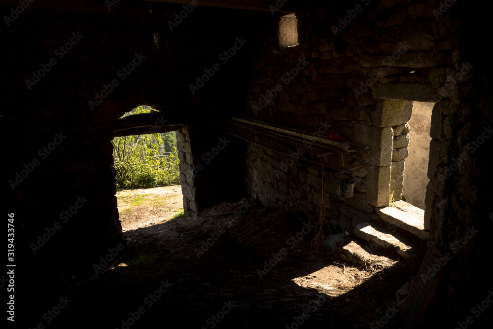 Old and abandoned space in stone with light inputs. Abstract concept of choice, path, option, decision. Old and abandoned space in stone with light inputs. Abstract concept of choice, path, option, decision.