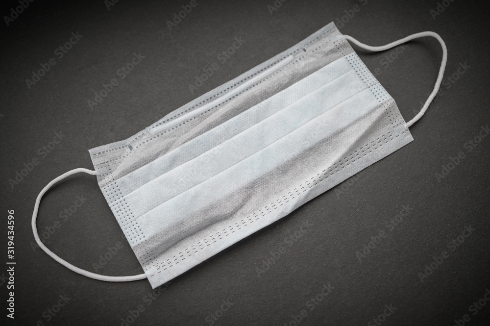 Protective medical mask on dark background. Protective medical mask on dark background.