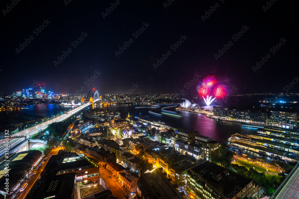 Obraz premium Sydney city skyline at night, aerial view with fireworks