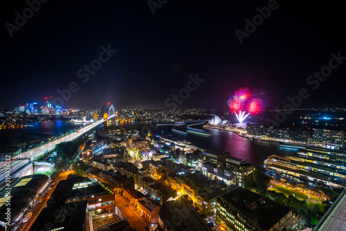 Sydney city skyline at night, aerial view with fireworks