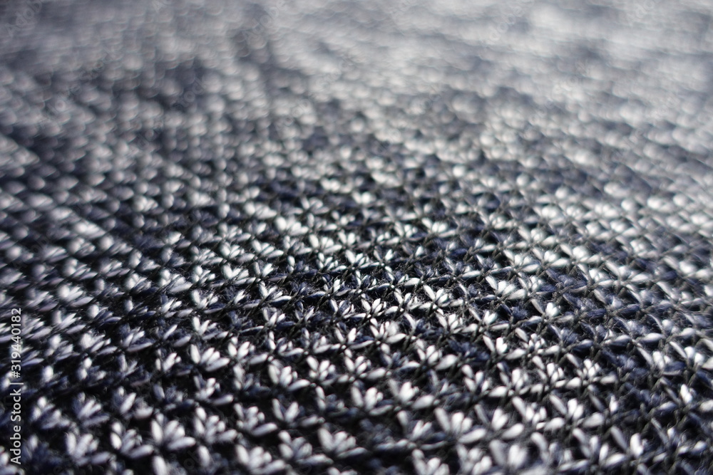 Close shot of heather blue grey woolen fabric Close shot of heather blue grey woolen fabric