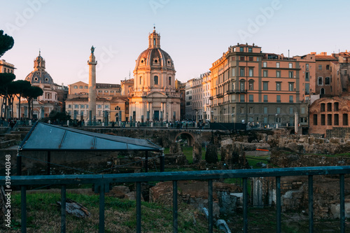 Rome, Italy - Jan 1, 2020: View across the ancient ruins of Trajan's Forum towards Trajan's Column and the Santa Maria di Loreto church in Rome, Italy
