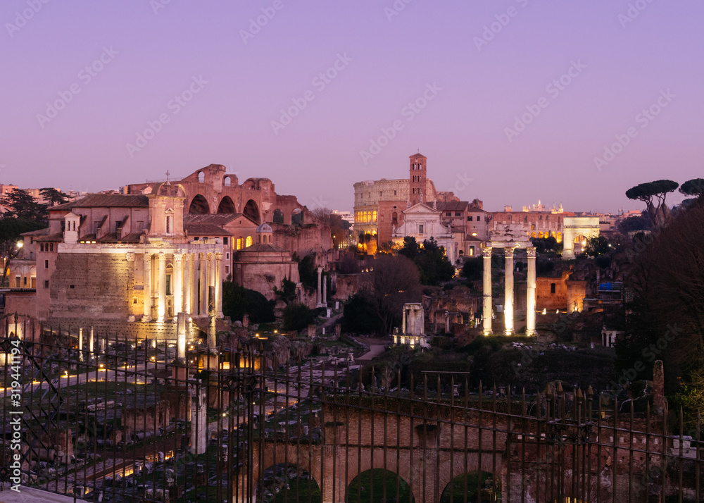 Fototapeta premium Rome, Italy - Jan 1, 2020: Roman Forum during dusk, Rome, Italy