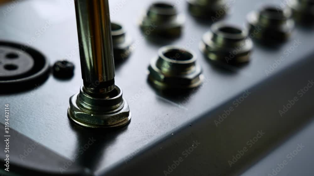 Musician DJ plugs 6.3 jack audio instrument cable in audio socket. Close up 4k Musician DJ plugs 6.3 jack audio instrument cable in audio socket. Close up 4k