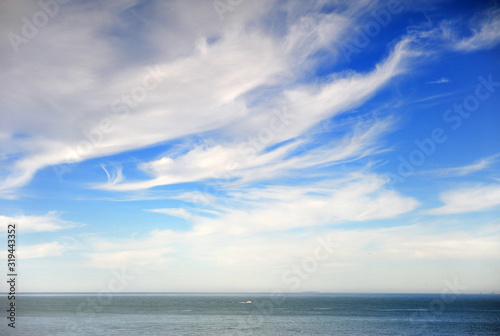 Scenic view of depp blue sea with cloudy sky