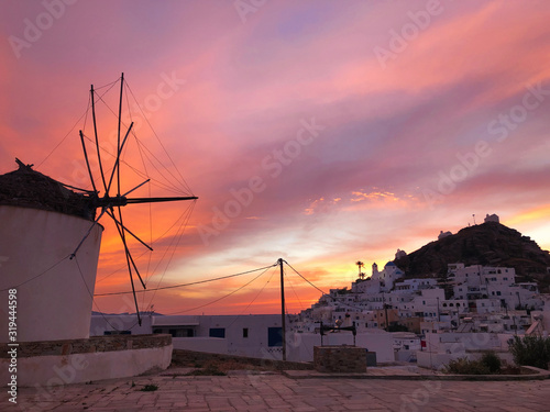 Dramatic colorful sky at sunset time over Ios town, Ios island, Greece