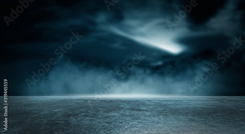 Futuristic empty night scene. Empty street scene background with abstract spotlights light. Night view of street light reflected on water. Rays through the fog. Smoke, fog, wet asphalt with reflection