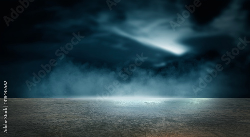 Futuristic empty night scene. Empty street scene background with abstract spotlights light. Night view of street light reflected on water. Rays through the fog. Smoke  fog  wet asphalt with reflection