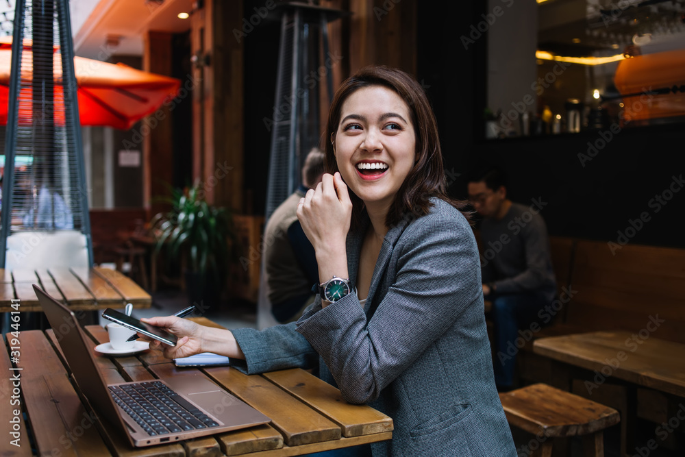 Young freelancer smiling while looking to side Young freelancer smiling while looking to side