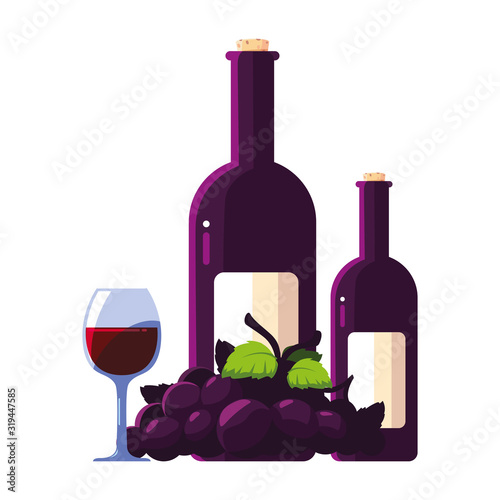 bottle and glass of wine with grapes
