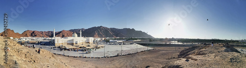 Jabal Uhud, Medina, Saudi Arabia - August 26, 2019:  Panorama view Jabal Uhud and Sayyid al Syuhada mosque during haze weather. It is historical places in Medina during umrah and hajj