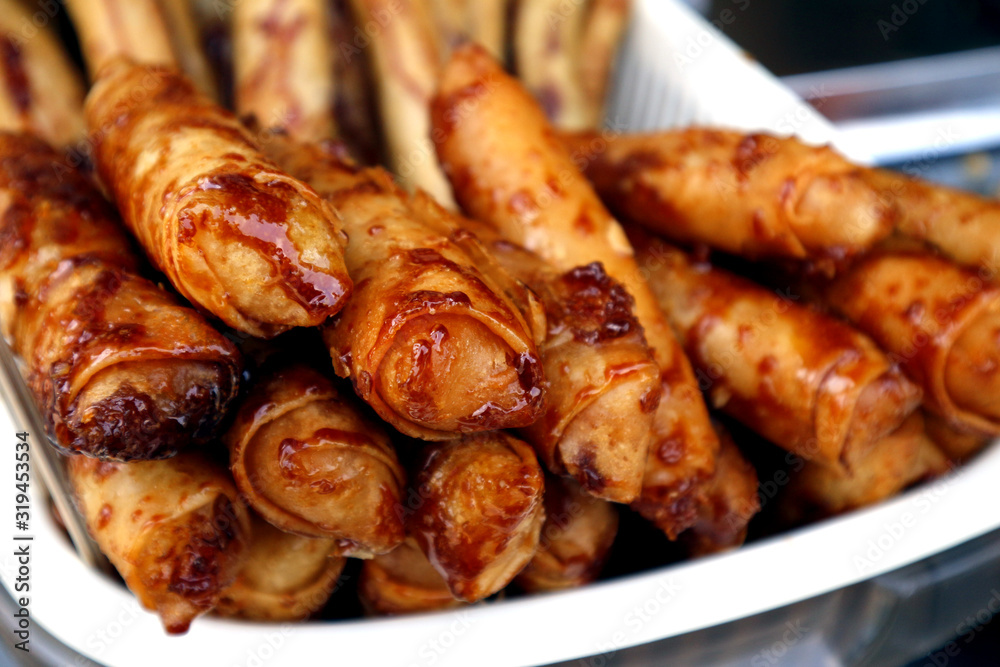 Freshly cooked Turon or deep fried saba banana in spring roll wrapper with brown sugar