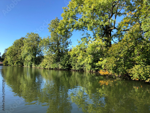 The lake Mannenweier or Mannenweiher pond (Three Ponds recreation area or Das Naherholungsgebiet Drei Weihern), Drei Weieren - St. Gallen, Switzerland photo