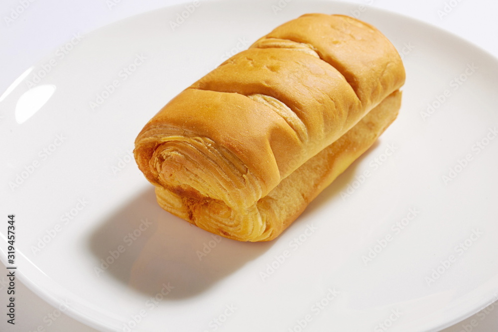 Homemade fluffy bread and biscuits on a white background Homemade fluffy bread and biscuits on a white background