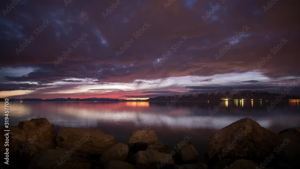 Time lapse of sunset fading and clouds glowing over Utah Lake from Provo city lights. Time lapse of sunset fading and clouds glowing over Utah Lake from Provo city lights.