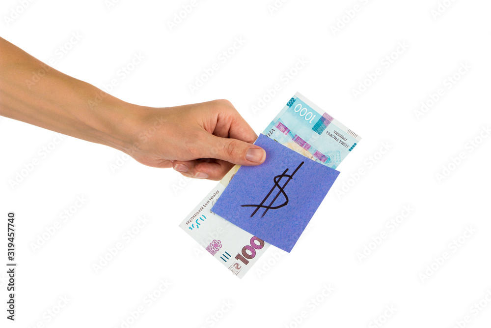 Thousand hryvnias and sticker with different financial signs and symbols in the hand Thousand hryvnias and sticker with different financial signs and symbols in the hand
