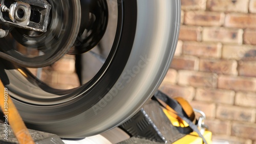 Back wheel of a motorcycle spinning during dynamometer test