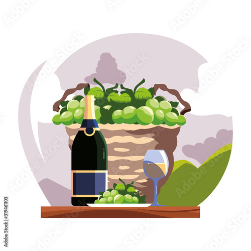 bottle and glass of wine with grapes
