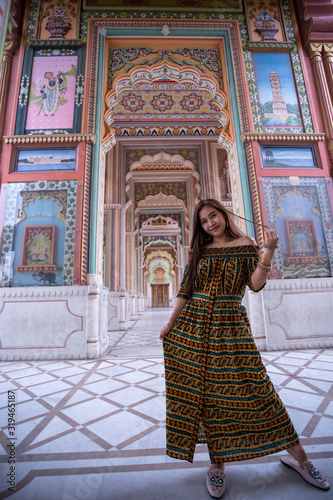 Young asian woman posing at Patrika gate, Jaipur, Rajasthan, India photo