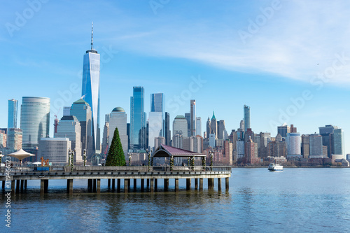 Fototapeta Naklejka Na Ścianę i Meble -  Lower Manhattan New York City Skyline seen from Jersey City with a Christmas Tree