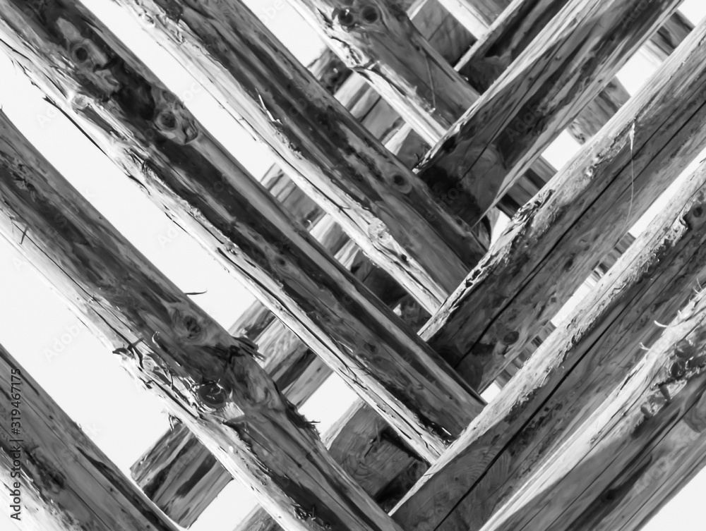 Wooden skeleton of a summer building under construction. Wooden skeleton of a summer building under construction.