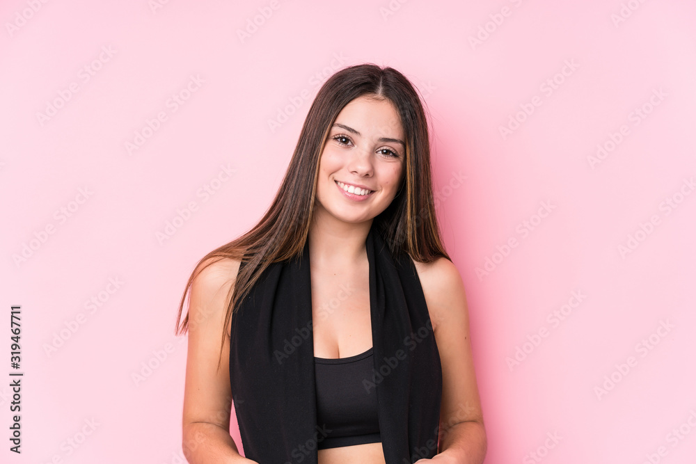 Young caucasian sporty woman holding a towel
