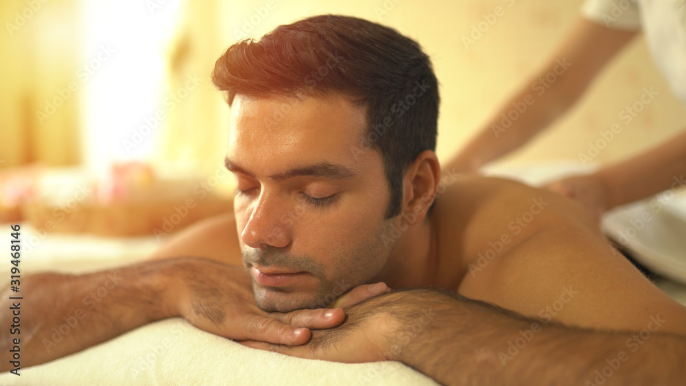 Obraz premium Young caucasian man relax during massage